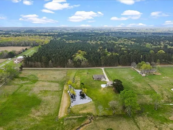 a view of a lake with a yard