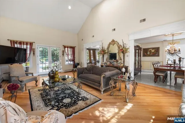 a living room with furniture a rug and a flat screen tv