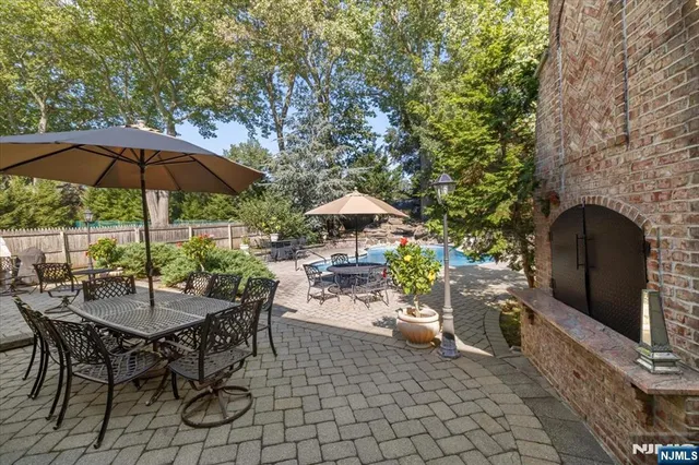 a view of a tables and chairs under an umbrella