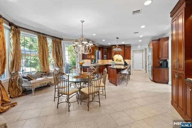 a view of a dining room with furniture window and outside view
