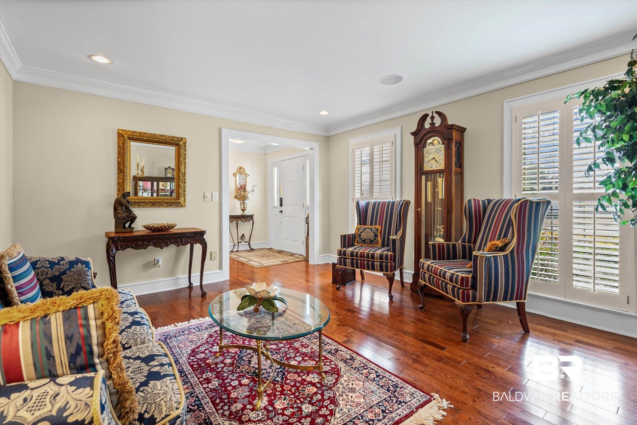 1517 Ridgeland Road East Mobile, AL 36695 - Photo 4 of 39 Living area with dark wood finished floors, crown molding, and recessed lighting