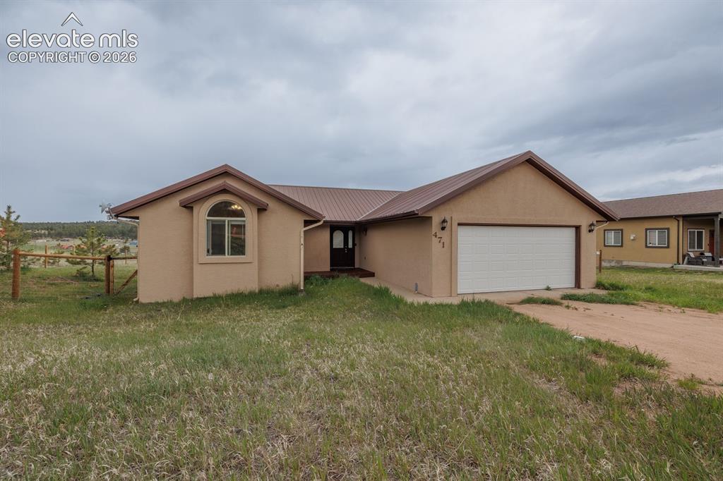 471 Due S Road Florissant, CO 80816 - Photo 2 of 35 a view of a house with a yard