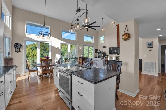 a kitchen with stainless steel appliances granite countertop a stove and refrigerator