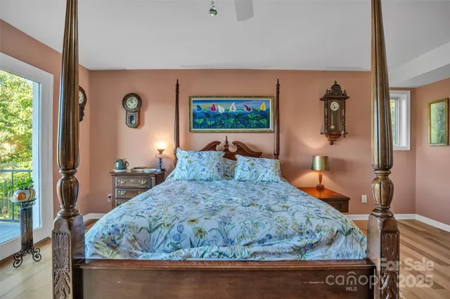 a bed sitting in a bedroom next to a window