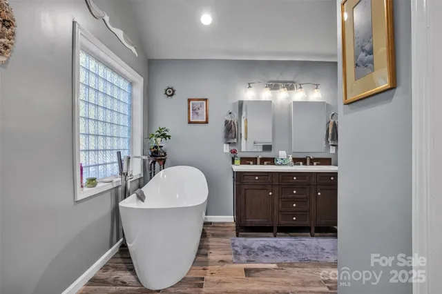 a room with a sink and a mirror