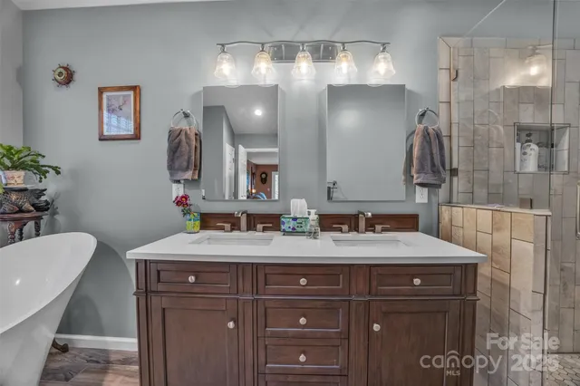 a bathroom with a sink vanity and a mirror