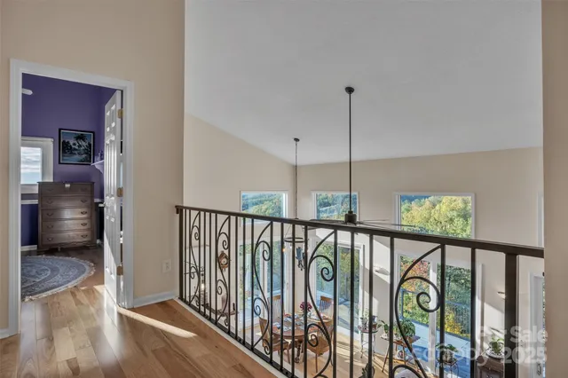 a view of hallway with wooden floor