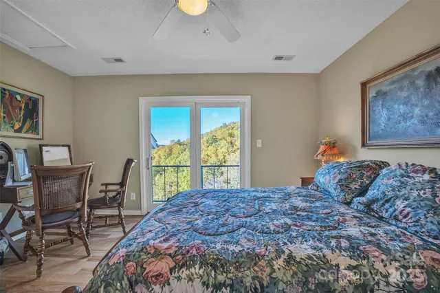 a bedroom with a bed and a table in it