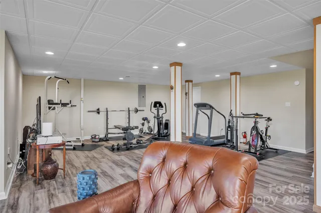 a bed room with furniture and a view of living room