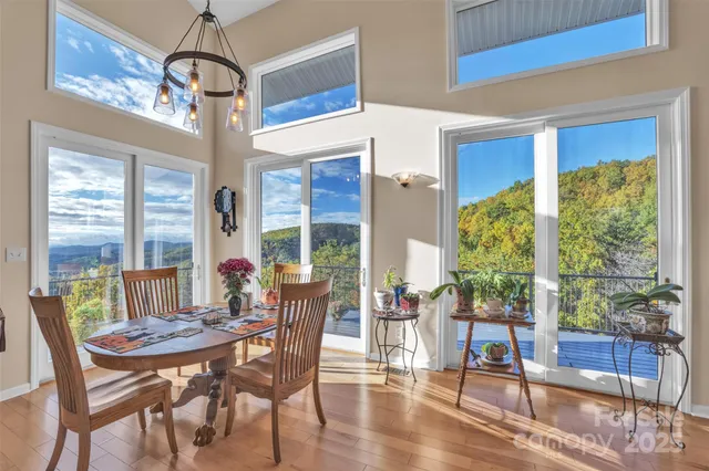 a view of a dining room with furniture window and wooden floor