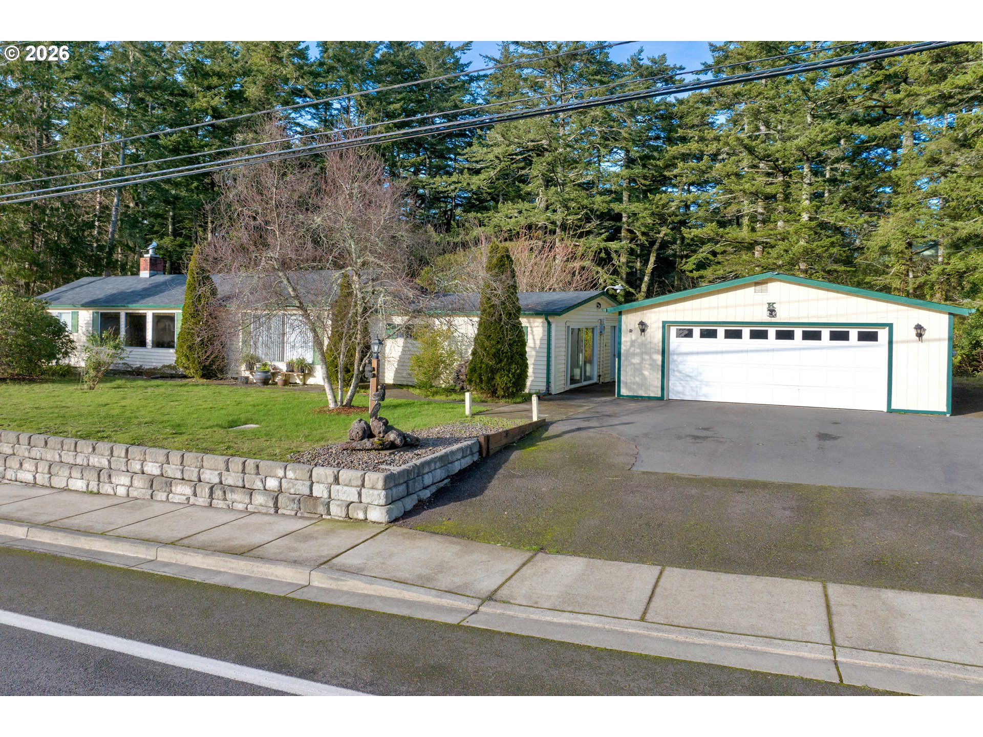 a front view of a house with a garden