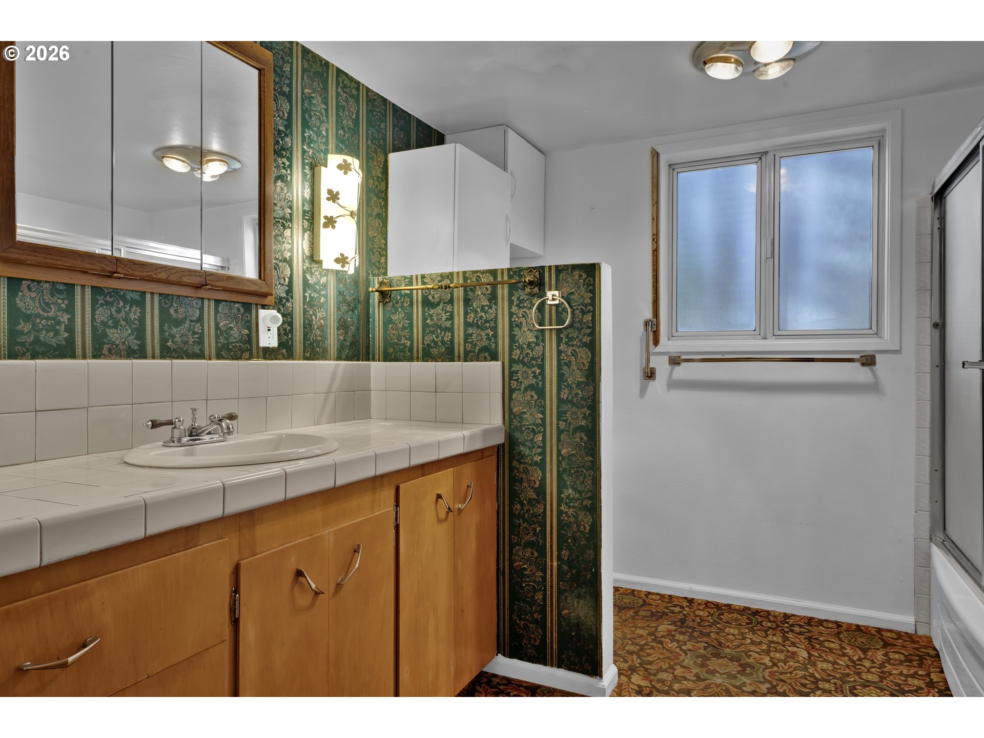 777 Rhododendron Drive Florence, OR 97439 - Photo 13 of 41 a bathroom with a sink and a mirror
