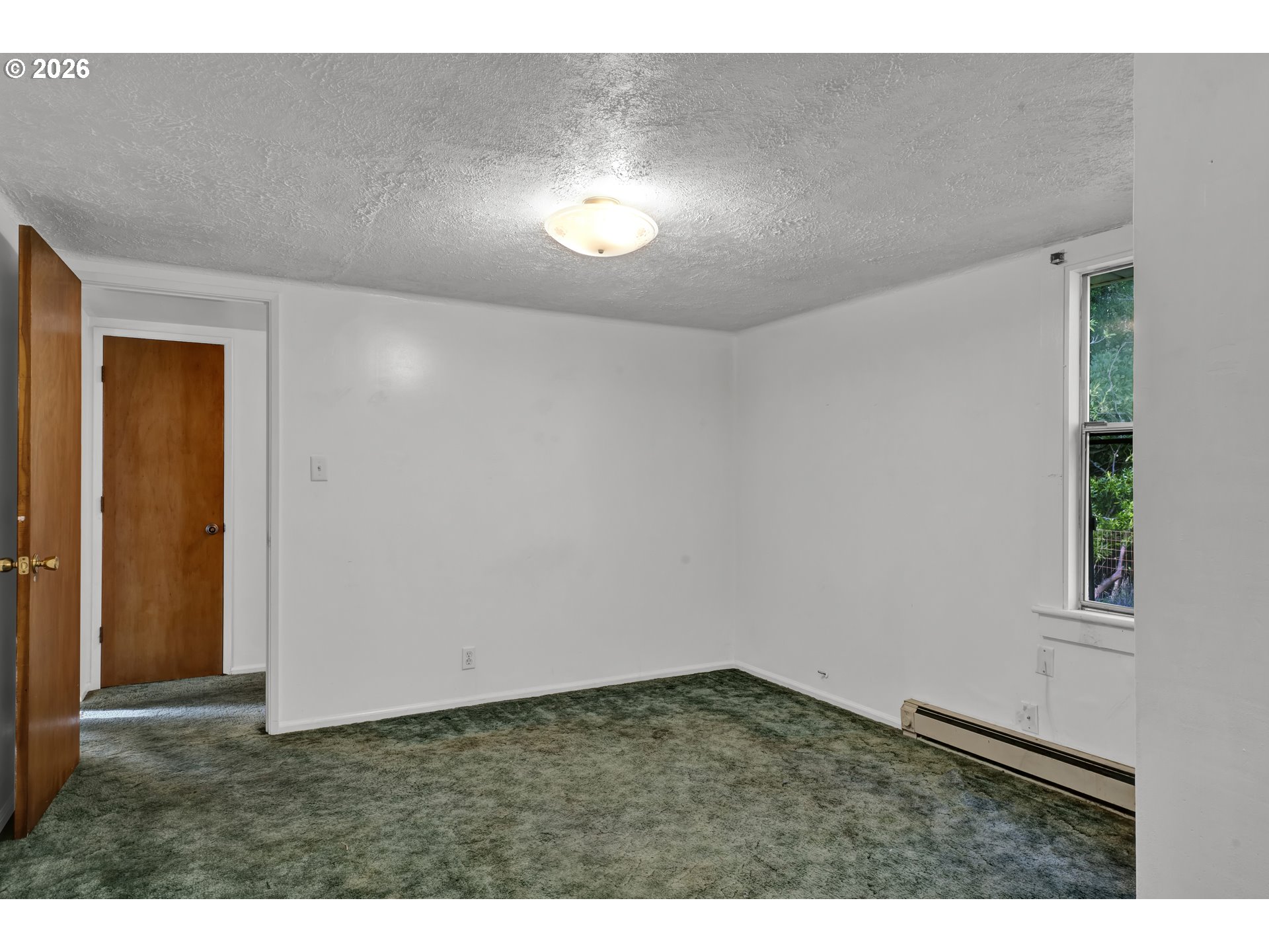 777 Rhododendron Drive Florence, OR 97439 - Photo 16 of 41 a view of an empty room and window