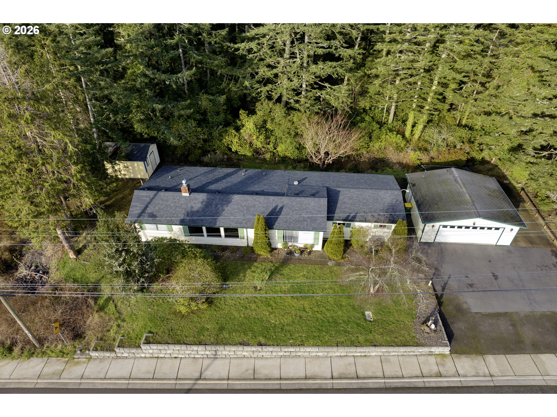 777 Rhododendron Drive Florence, OR 97439 - Photo 2 of 41 an aerial view of a house with a yard