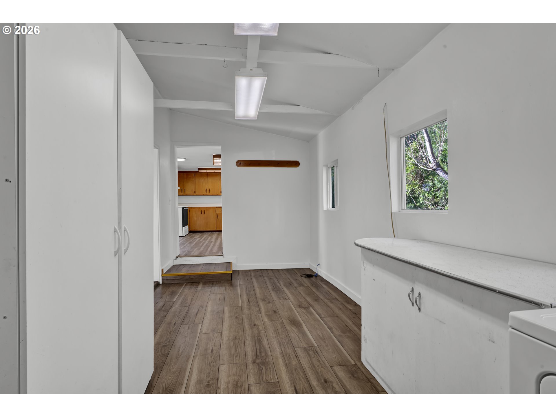 777 Rhododendron Drive Florence, OR 97439 - Photo 23 of 41 a view of empty room with wooden floor