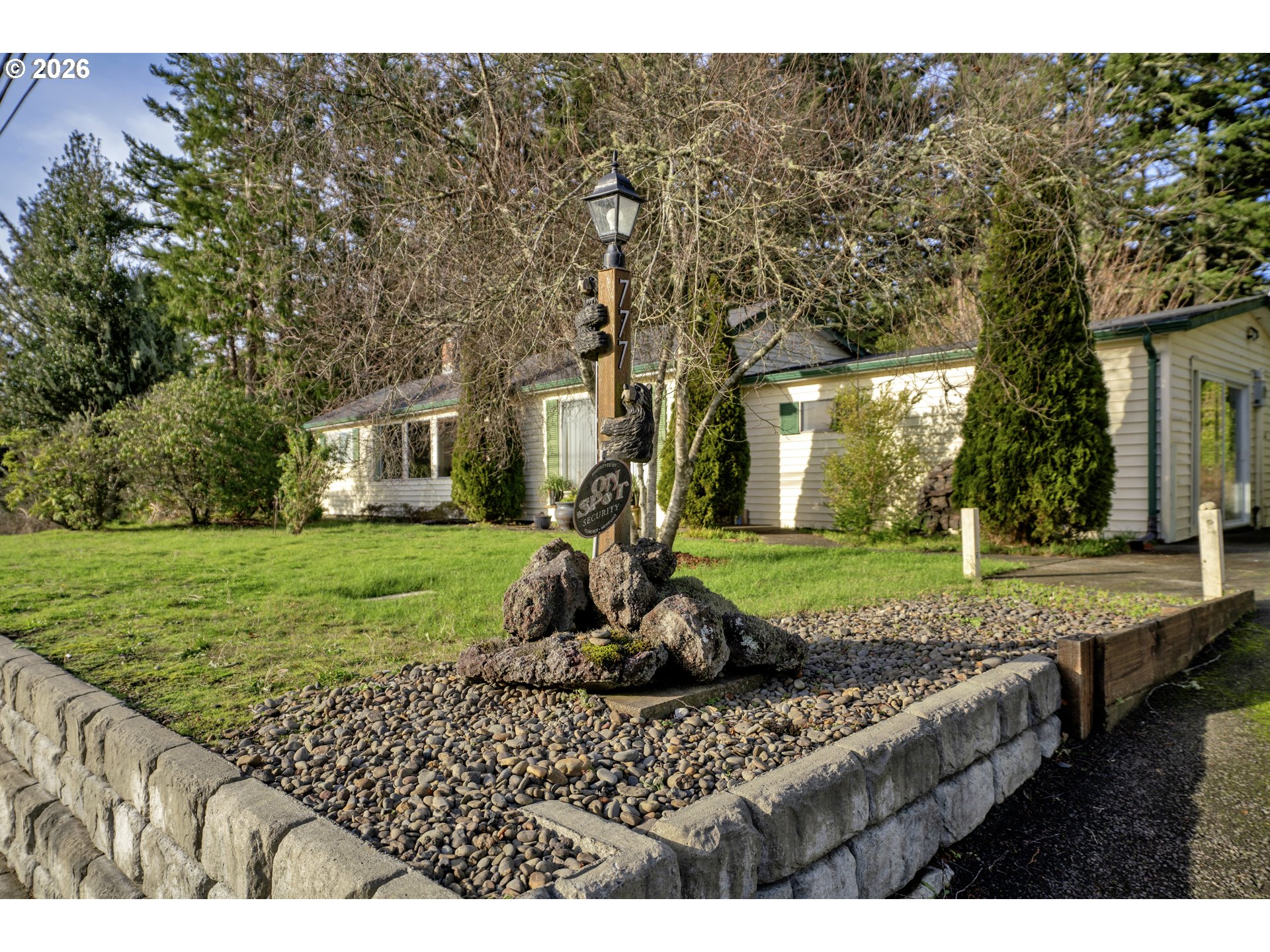 777 Rhododendron Drive Florence, OR 97439 - Photo 34 of 41 a view of a house with backyard and garden