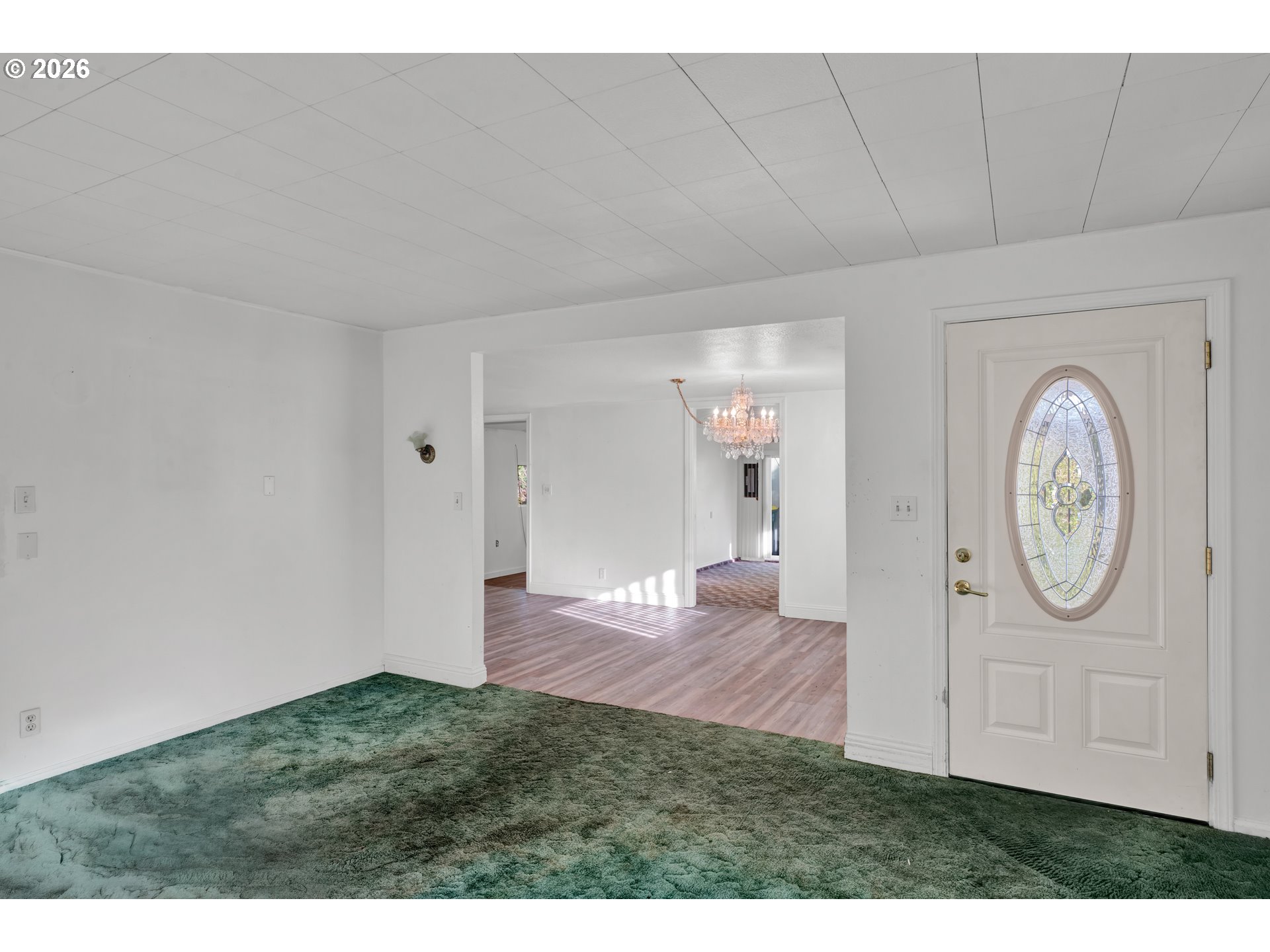 777 Rhododendron Drive Florence, OR 97439 - Photo 6 of 41 a view of a livingroom with wooden floor and a fireplace