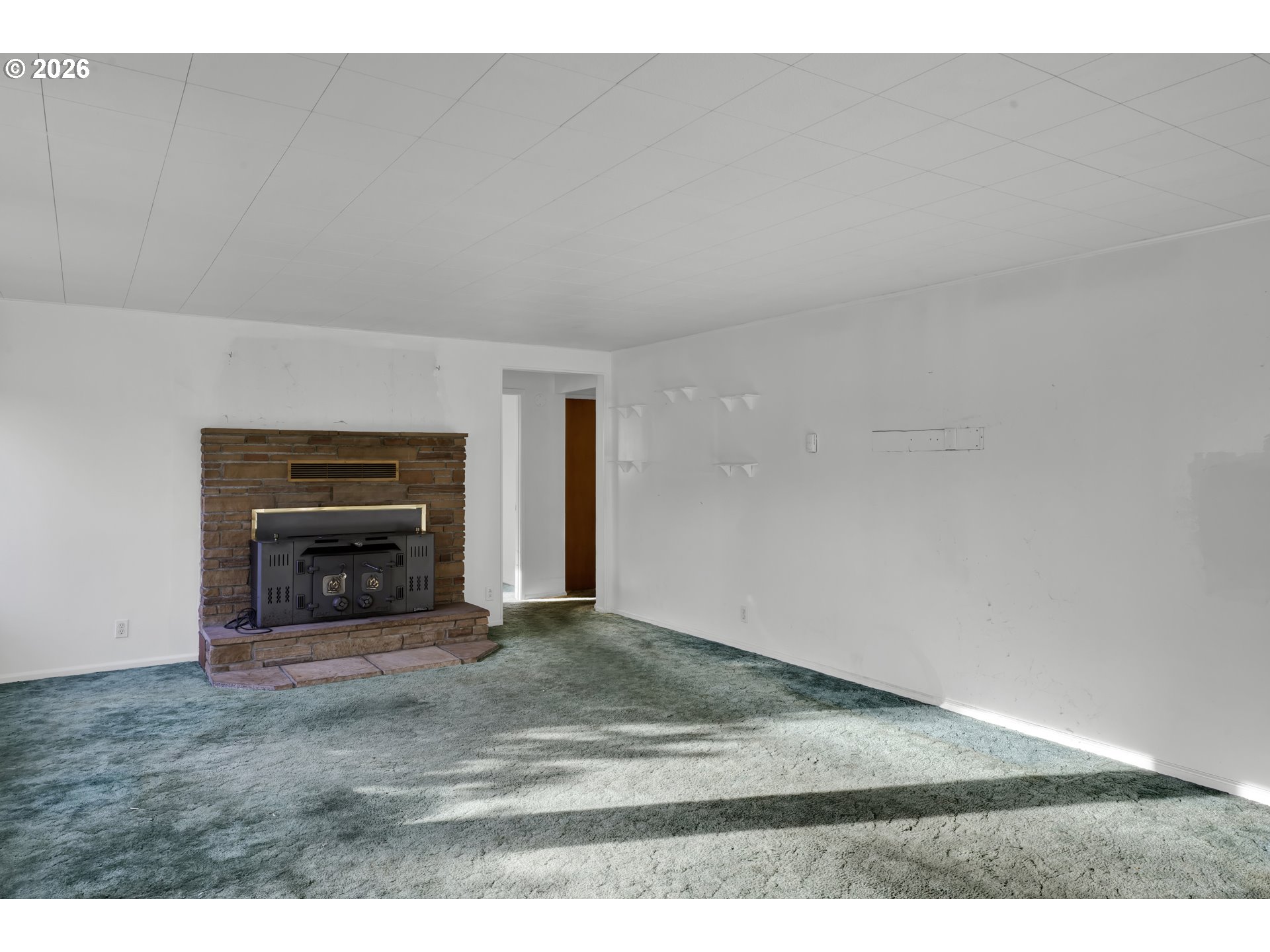 777 Rhododendron Drive Florence, OR 97439 - Photo 9 of 41 a view of an empty room and fire place
