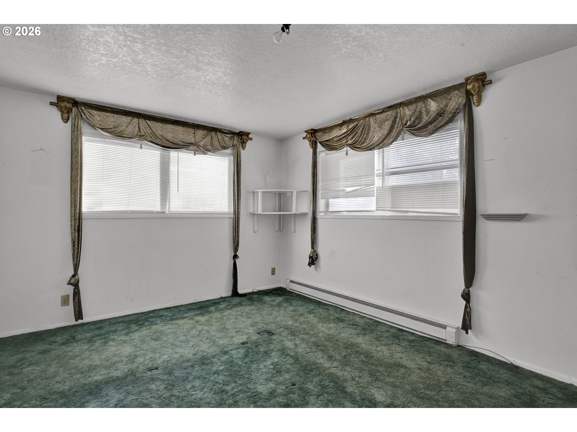 777 Rhododendron Drive Florence, OR 97439 - Photo 10 of 41 a view of an empty room with a window