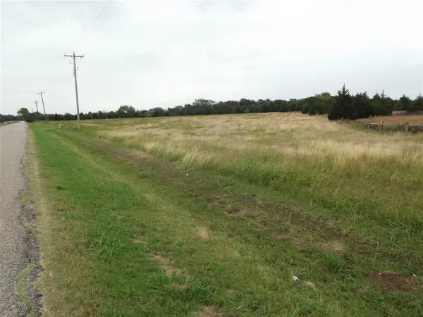 a view of a lake with houses in background