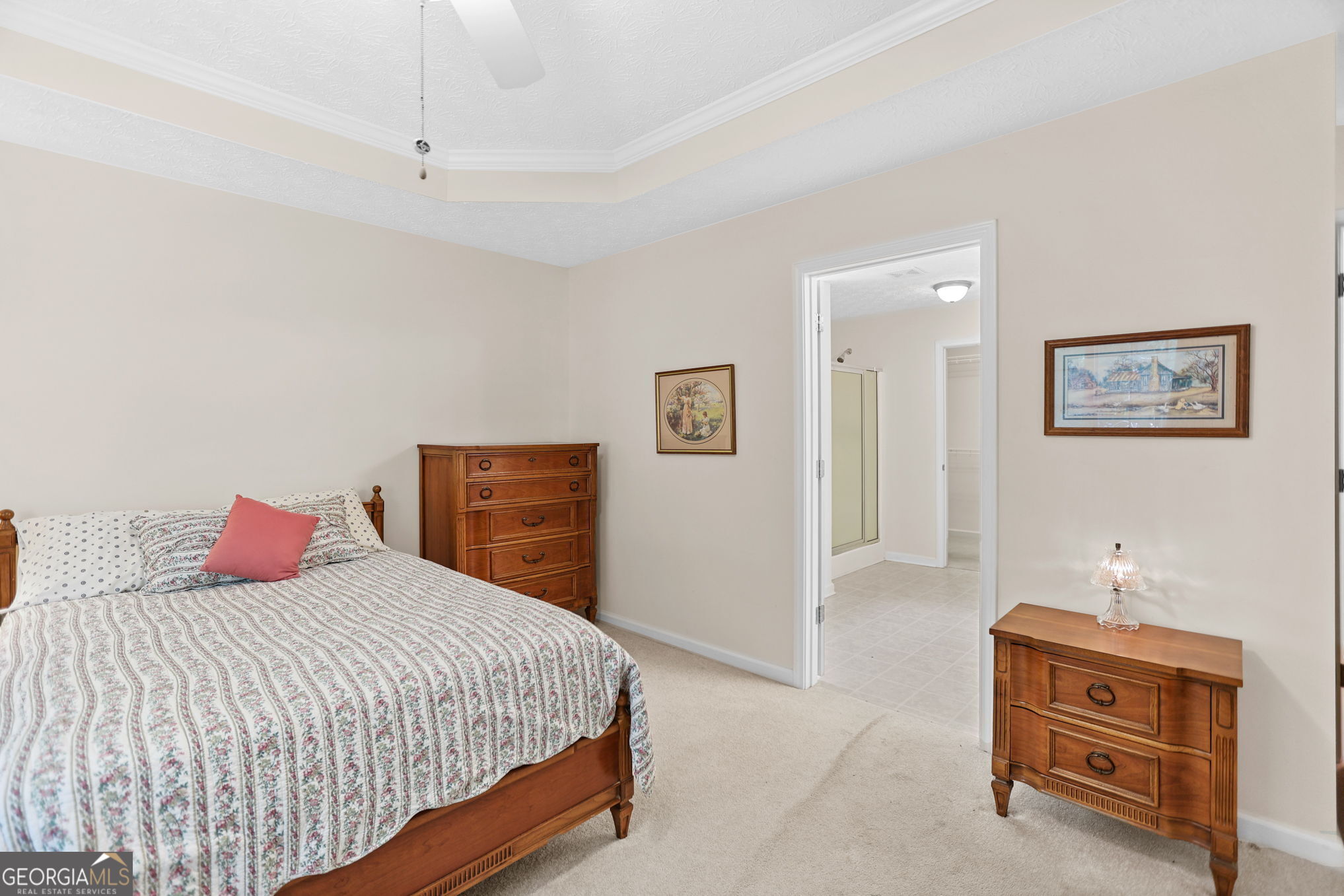 892 Brooks Woolsey Road Brooks, GA 30205 - Photo 21 of 45 a bedroom with a bed and a chandelier