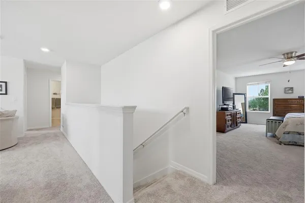 a view of walk in closet with clothes