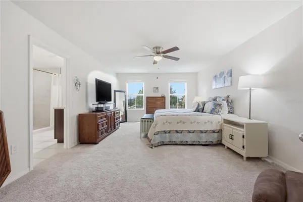 a view of walk in closet with clothes