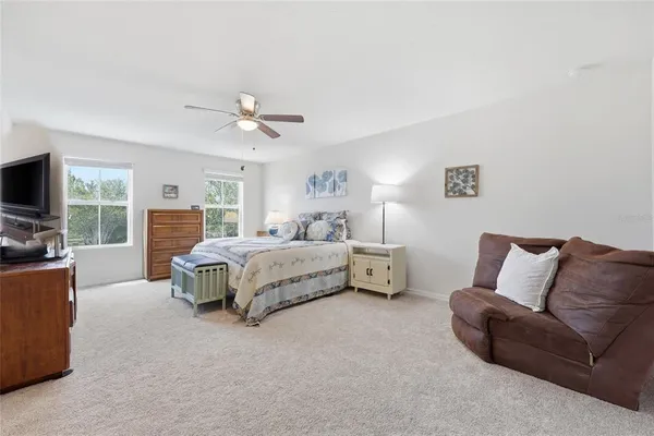 a white toilet sitting next to a small bathroom