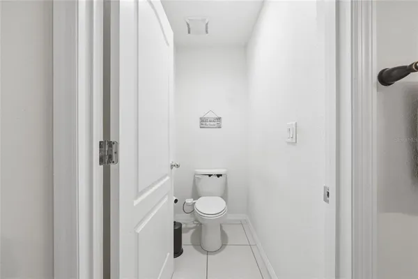 a view of a hallway with a wooden floor