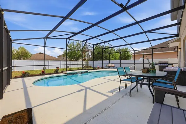 a view of a swimming pool with a patio