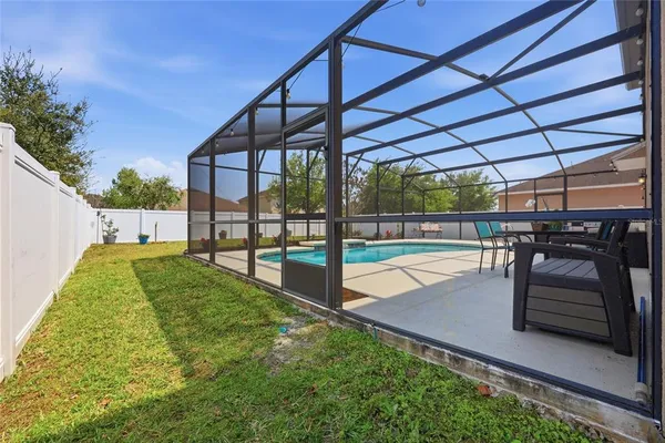 an aerial view of swimming pool with a lake view