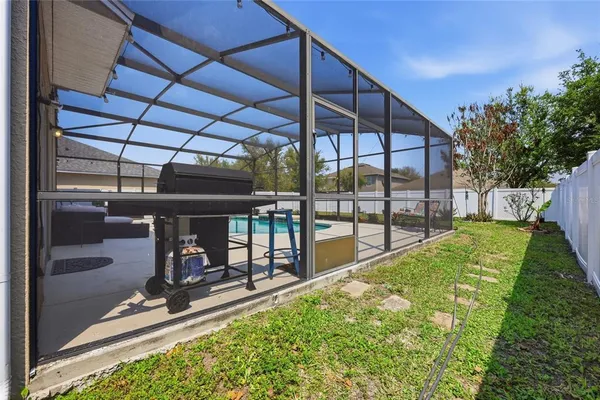 an aerial view of a house with a lake view