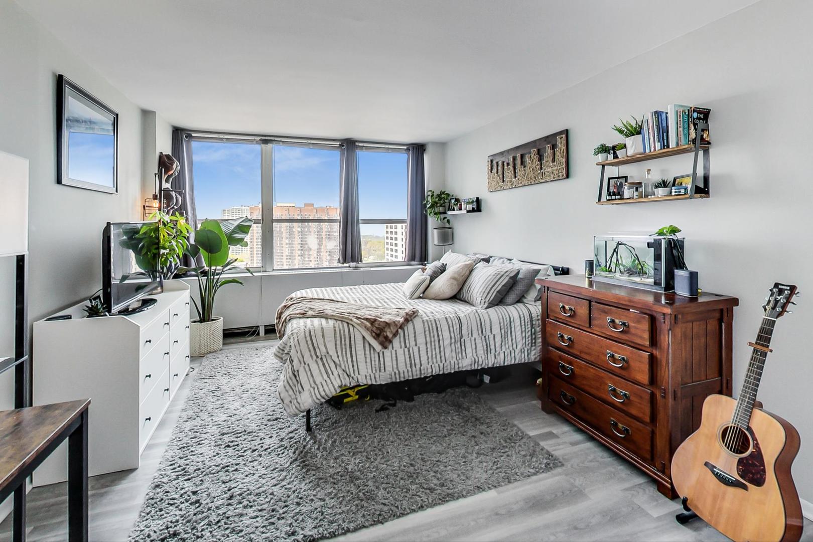 655 West Irving Park Road, Unit 1908 Chicago, IL 60613 - Photo 17 of 29 a bedroom with a bed and a couch