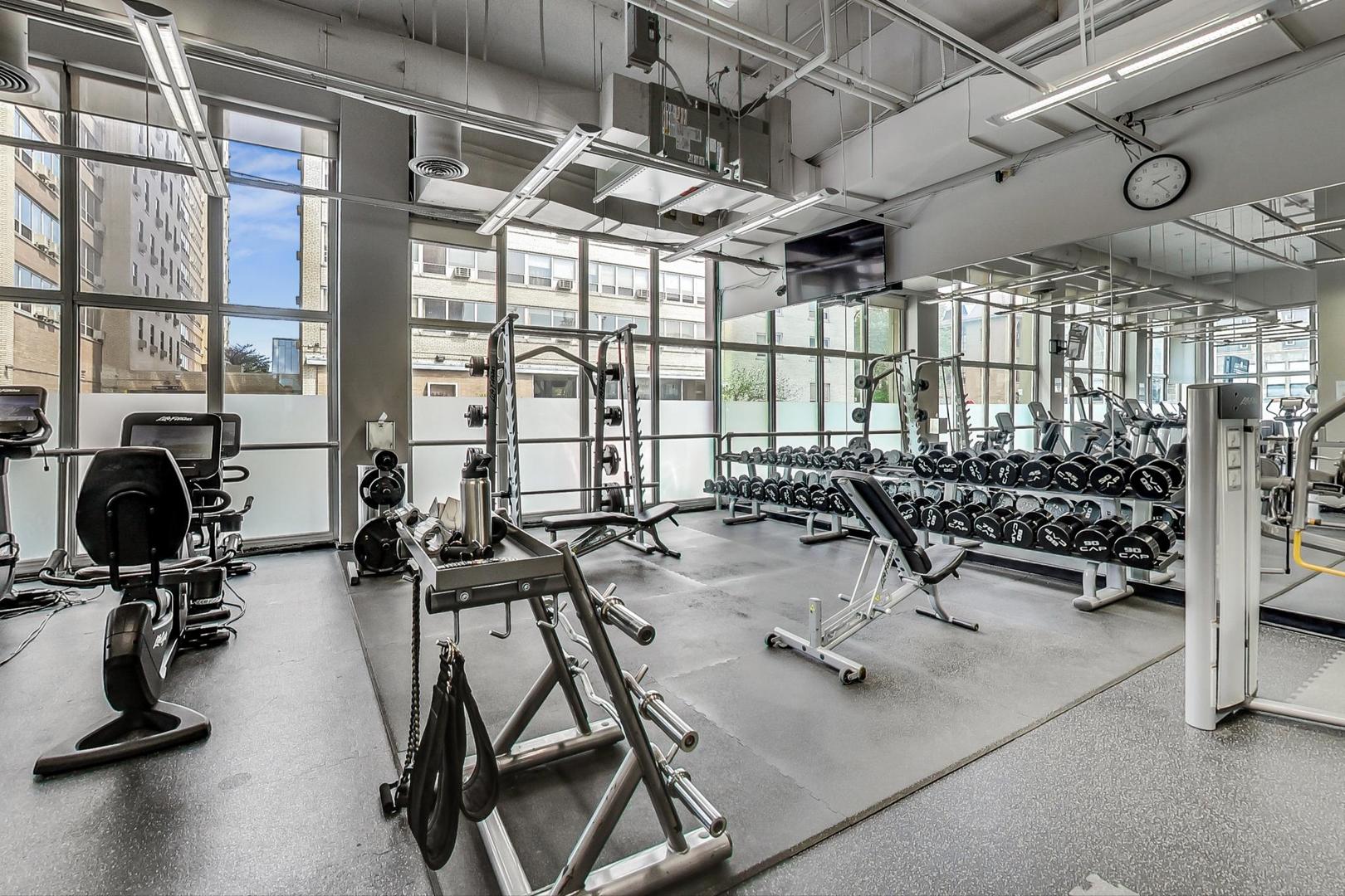 655 West Irving Park Road, Unit 1908 Chicago, IL 60613 - Photo 21 of 29 a view of a room with gym equipment