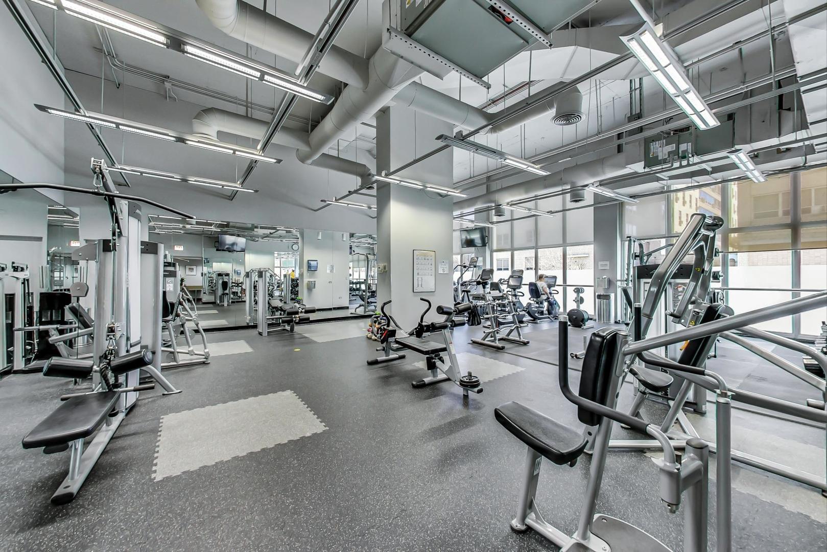 655 West Irving Park Road, Unit 1908 Chicago, IL 60613 - Photo 22 of 29 a view of a room with gym equipment