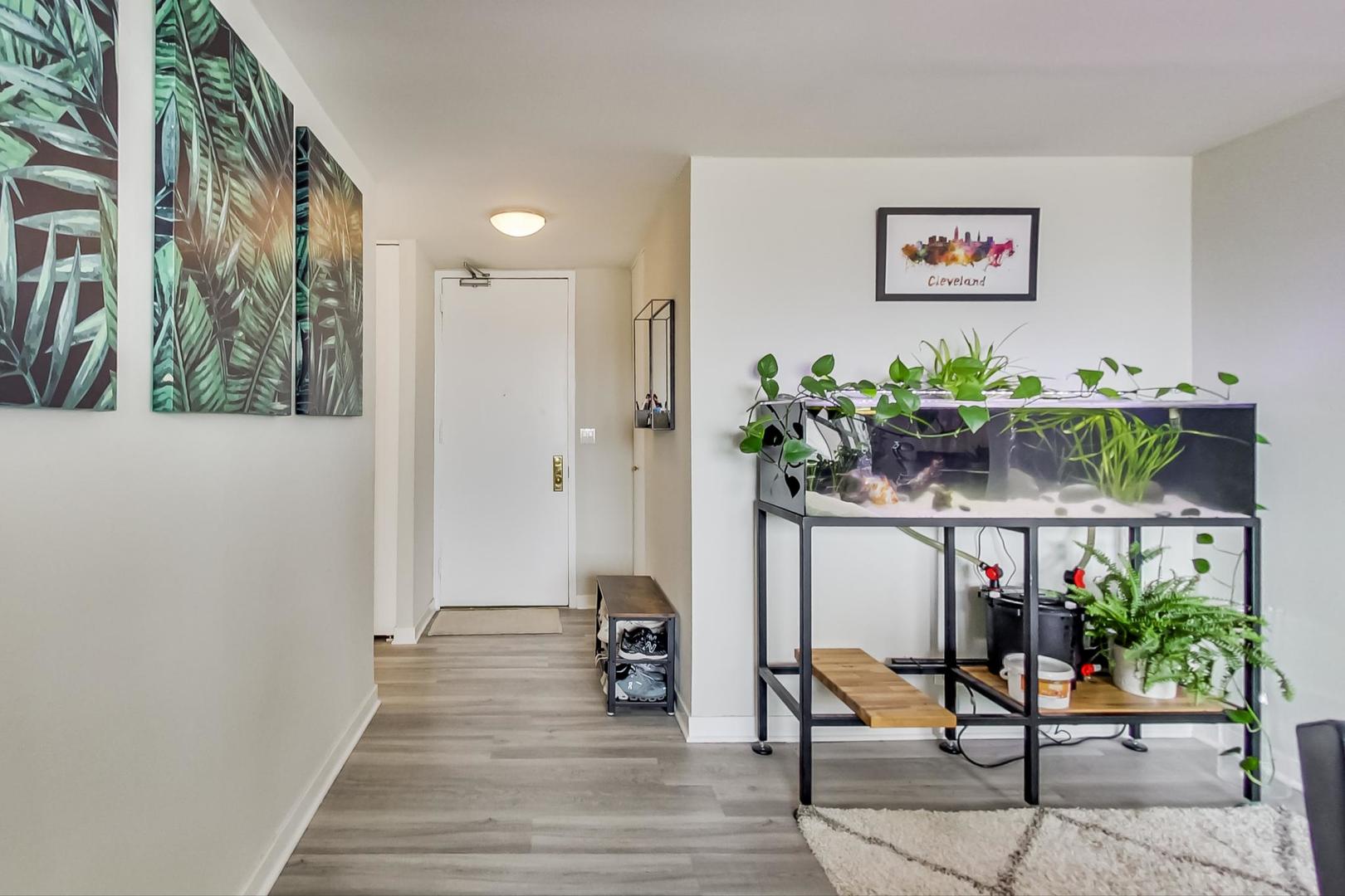 655 West Irving Park Road, Unit 1908 Chicago, IL 60613 - Photo 4 of 29 a room with furniture and potted plant