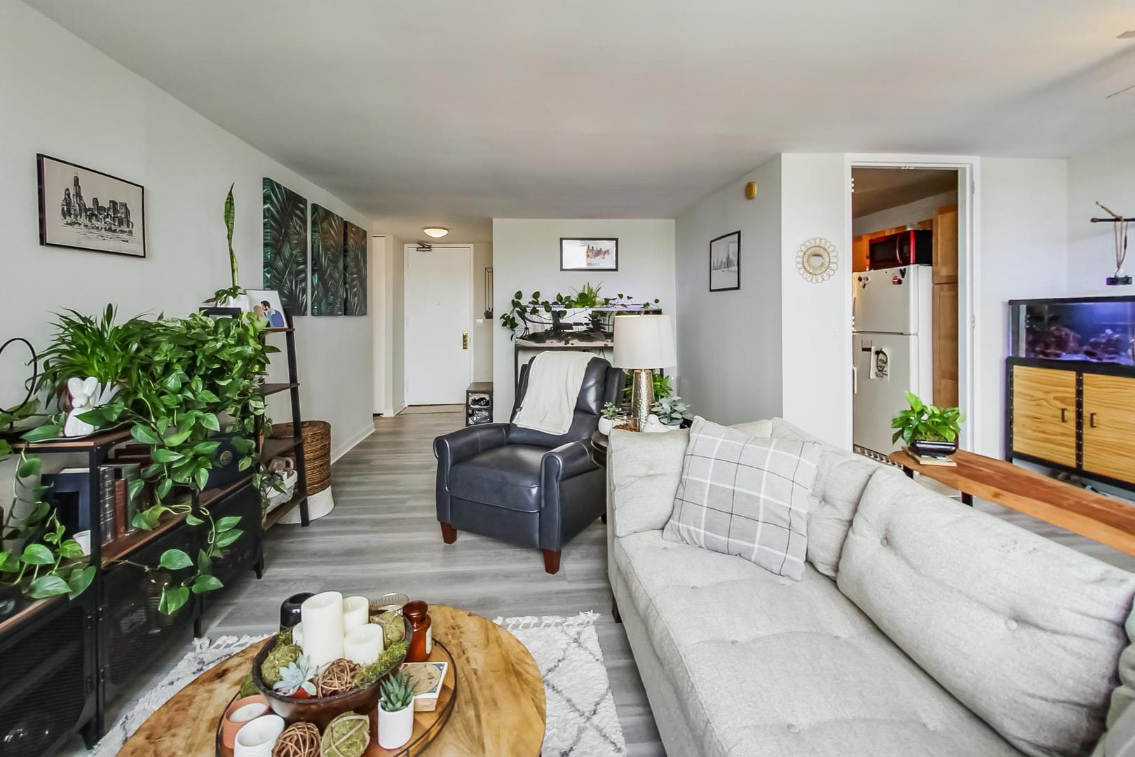 655 West Irving Park Road, Unit 1908 Chicago, IL 60613 - Photo 9 of 29 a living room with furniture and a couch