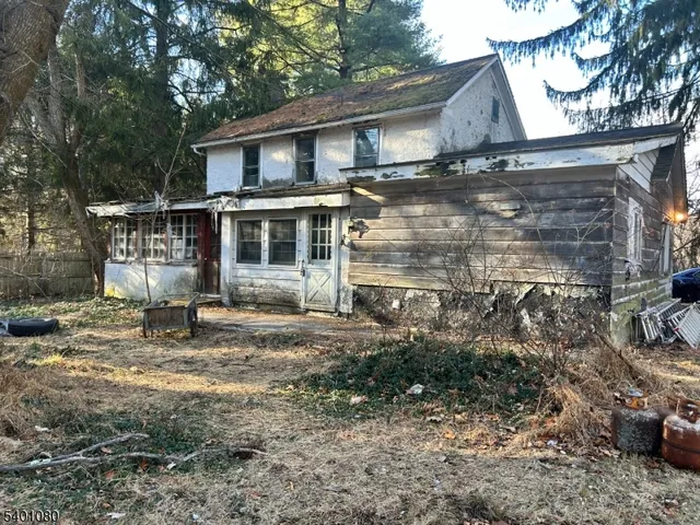 a house with trees in the background