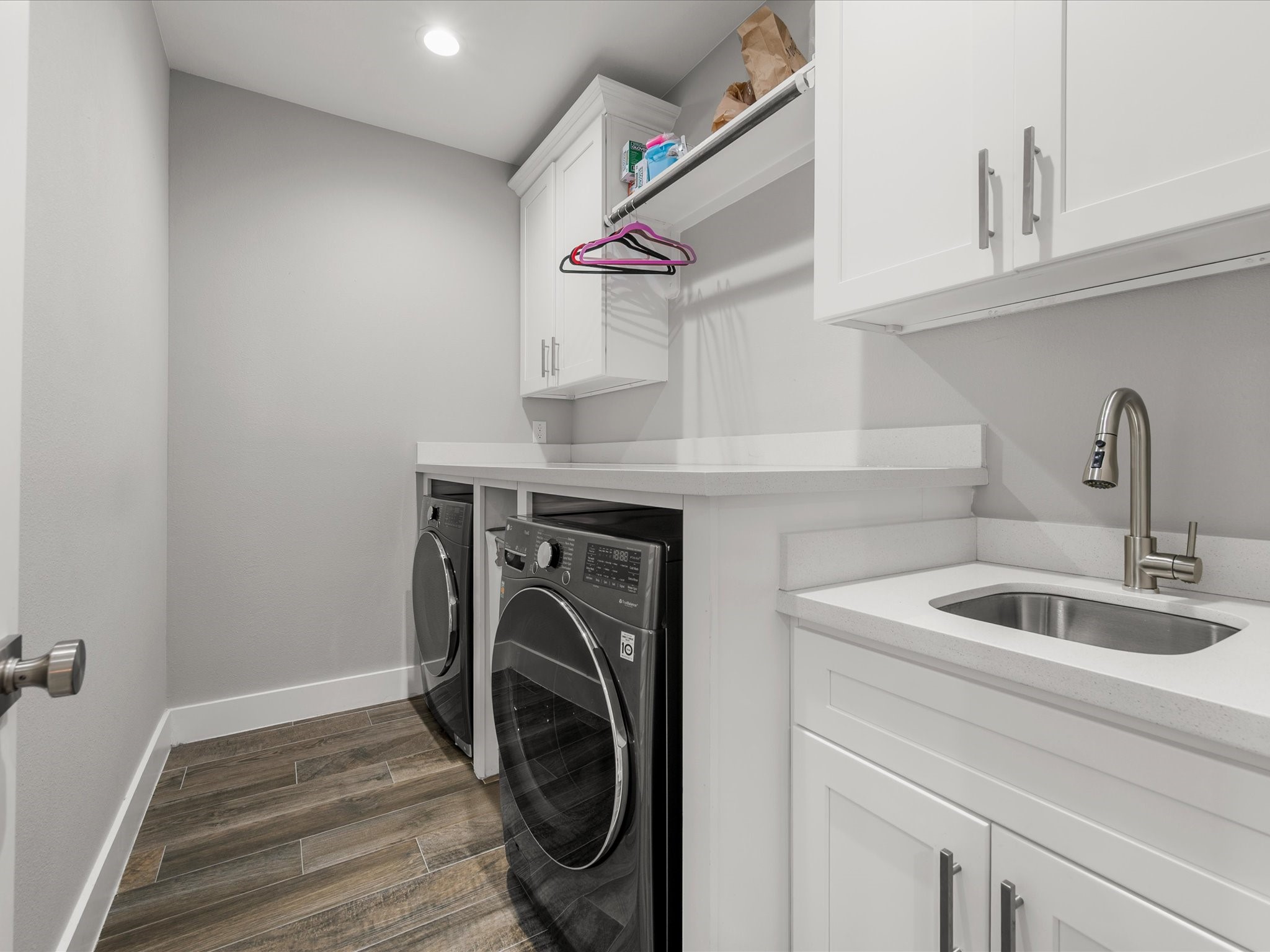 6207 Graff Net Court Spring, TX 77379 - Photo 39 of 48 The spacious utility room combines function and convenience with ample cabinetry, a utility sink, and plenty of room for everyday organization.