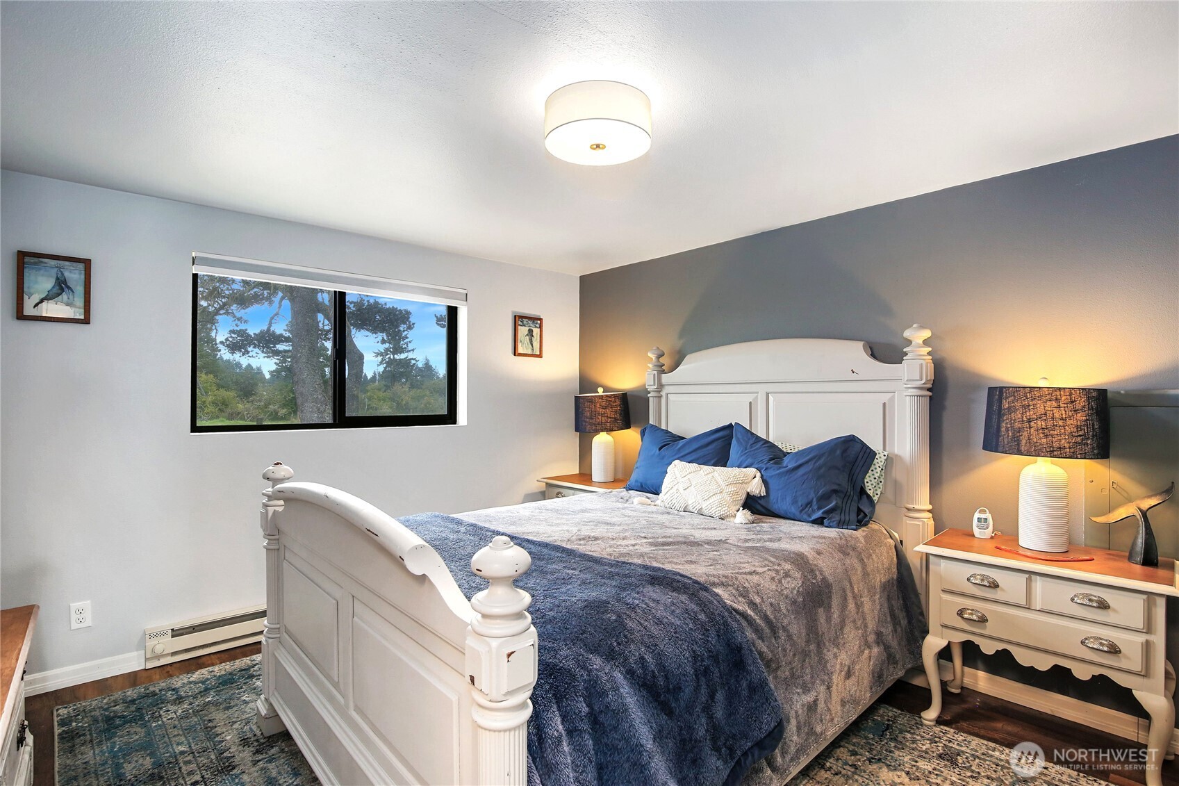 1968 State Route 105 Aberdeen, WA 98520 - Photo 11 of 39 a bedroom with a bed and a painting on the wall