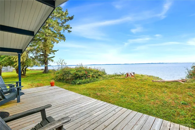 a view of a balcony with ocean view