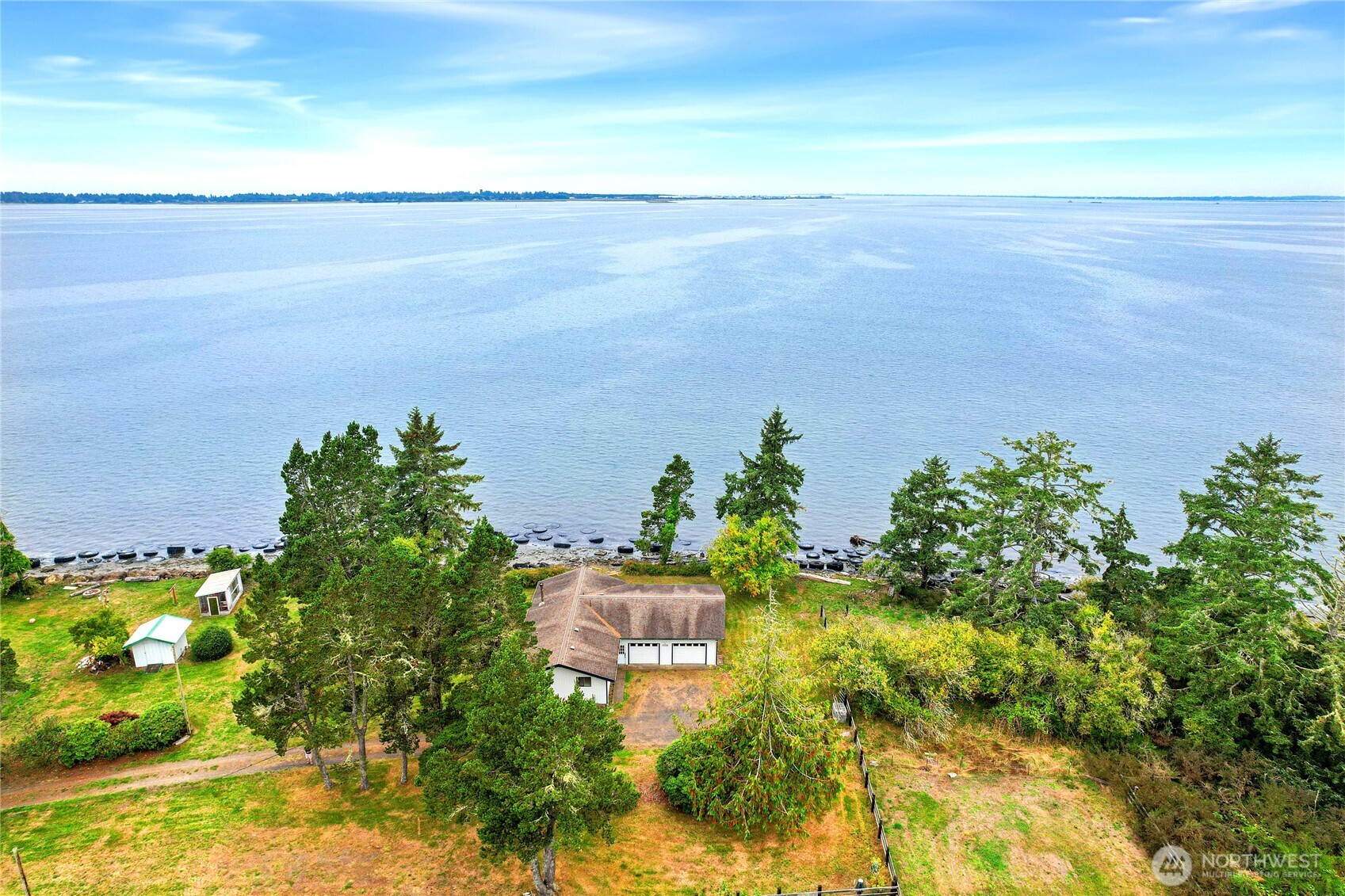 1968 State Route 105 Aberdeen, WA 98520 - Photo 36 of 39 a view of a yard with an outdoor space and seating area