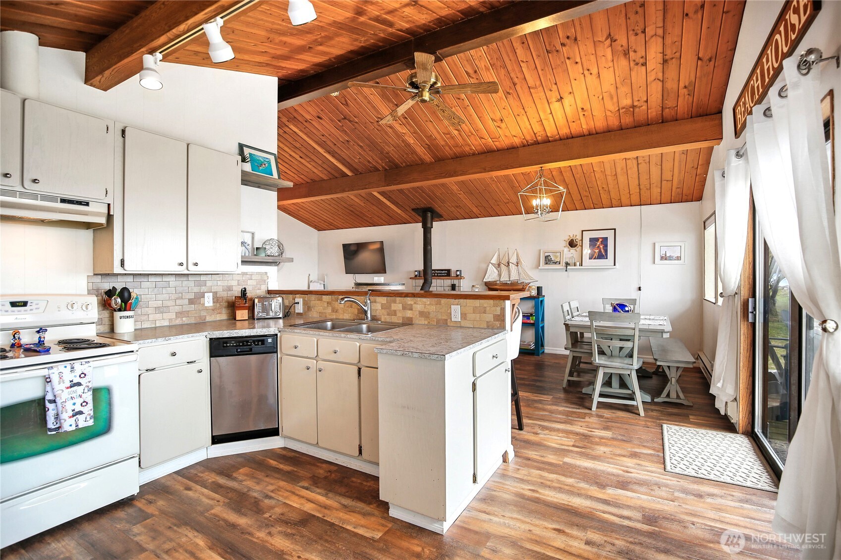 1968 State Route 105 Aberdeen, WA 98520 - Photo 4 of 39 a kitchen with stainless steel appliances a stove a sink dishwasher and a refrigerator