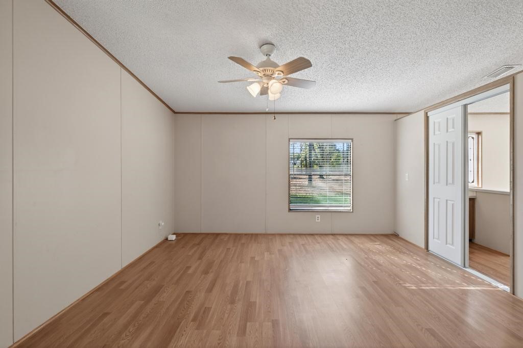 2744 Roy Sikes Road Hilliard, FL 32046 - Photo 51 of 97 wooden floor in an empty room with a window
