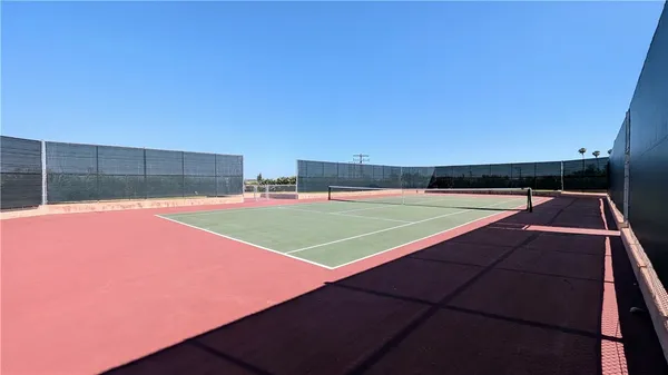 a view of an outdoor space and tennis court