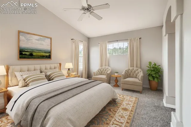 a bedroom with double bed and a window