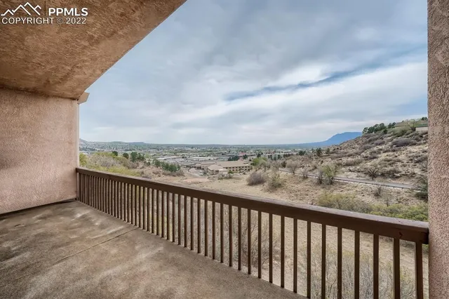 a view of balcony with furniture