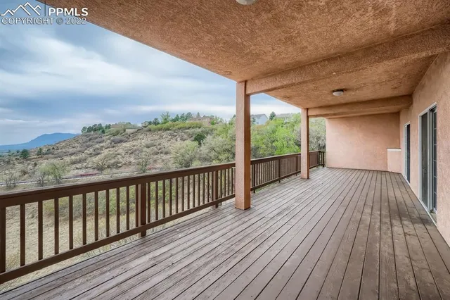 a view of balcony with wooden floor
