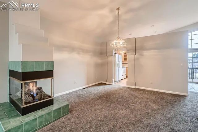 a view of a room with toys and wooden floor