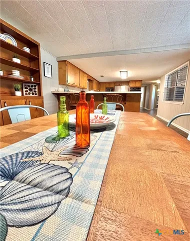 a kitchen with stainless steel appliances a sink and a refrigerator